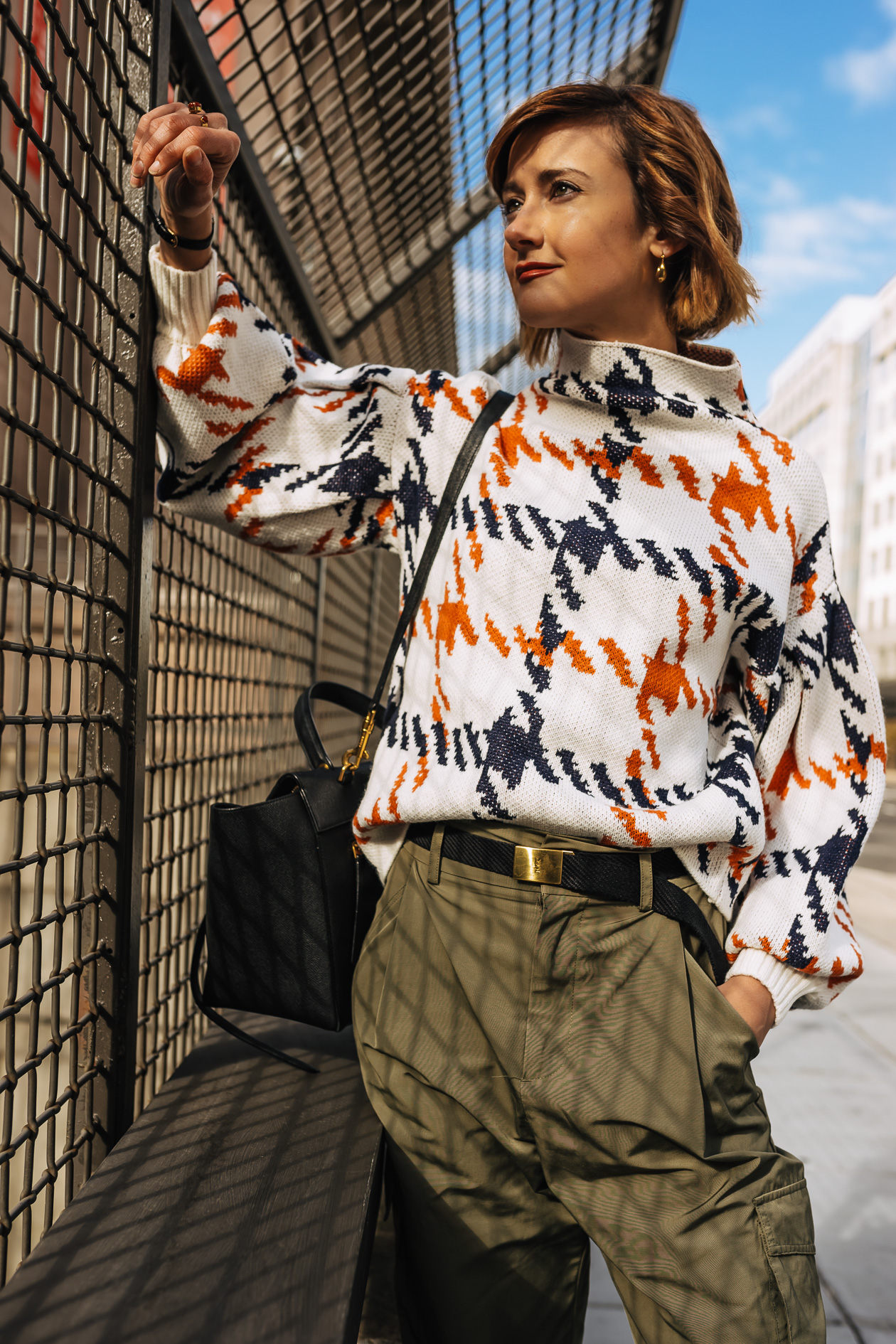 bright print sweater with cargo pants